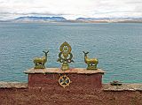 Tibet Kailash 07 Manasarovar 10 Gossul Gompa With Lake Lake Manasarovar (4560m), or Mapham Yum Tso (Victorious Lake) in Tibetan, is the most venerated of Tibets many lakes. Manasarovar has been circumambulated by Indian pilgrims for at least 1700 years when it was extolled in the sacred Sanskrit literature called the Puranas. Here is the view from Gossul Gompa.
